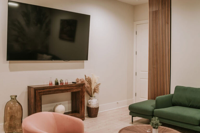 Giant TV in Master bedroom in Short Term Rental in Ocean Springs